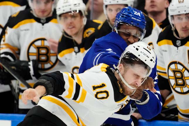 Toronto Maple Leafs’ Wayne Simmonds (24) and Boston Bruins’ A.J. Greer (10) fight during the third period, Feb.1, 2023, in Toronto.