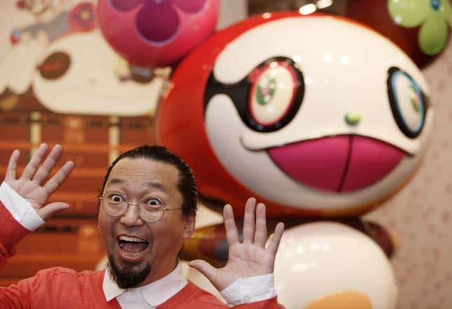 Japanese artist Takashi Murakami poses in front of his creation "Panda" in 2009