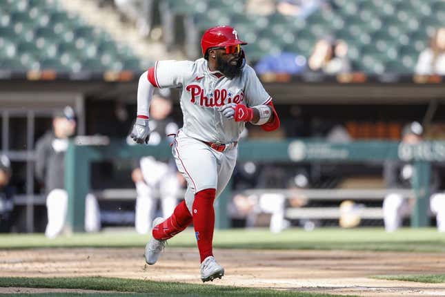 Apr 18, 2023; Chicago, Illinois, USA; Philadelphia Phillies second baseman Josh Harrison (2) runs to first base after hitting a two-run single against the Chicago White Sox during the third inning of game one of the doubleheader at Guaranteed Rate Field.