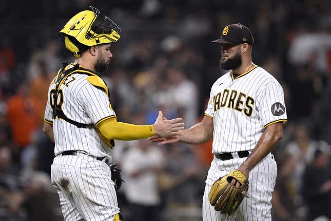 Aug 15, 2023; San Diego, California, USA; San Diego Padres catcher Gary Sanchez (99) and relief pitcher Luis Garcia (right) celebrate after defeating the Baltimore Orioles at Petco Park.