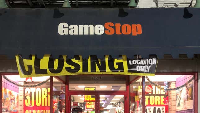 A GameStop store front shows a giant closing sign.