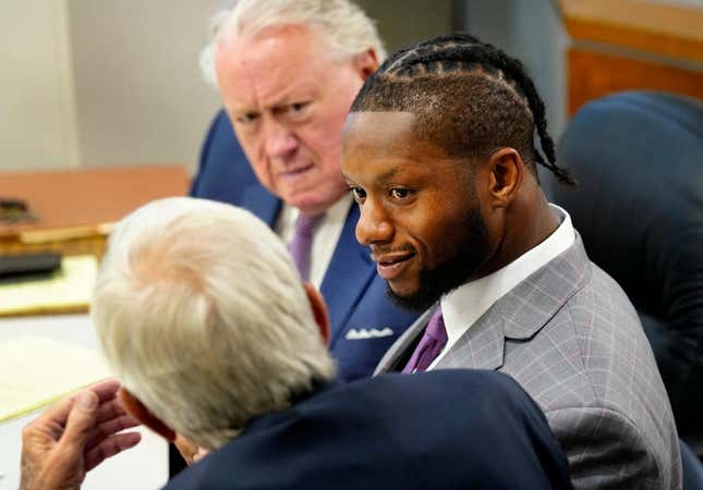Cincinnati Bengals running back Joe Mixon confers with his attorney s, Scott Croswell, center, and Meryln Shiverdecker, during day two of his aggravated menacing bench trial, Tuesday, August 15, 2023. Hamilton County Municipal Judge Gwen Bender is presiding over what prosecutors say was a road-rage incident involving a gun on Jan. 21, 2023 in downtown Cincinnati.