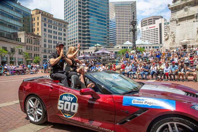 Simon Pagenaud waves to the crowd during the 2019 500 Festival parade