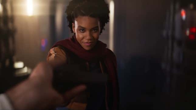 A female Resistance operative hands an unseen figure a datapad in an advert for Star Wars: Galactic Starcruiser