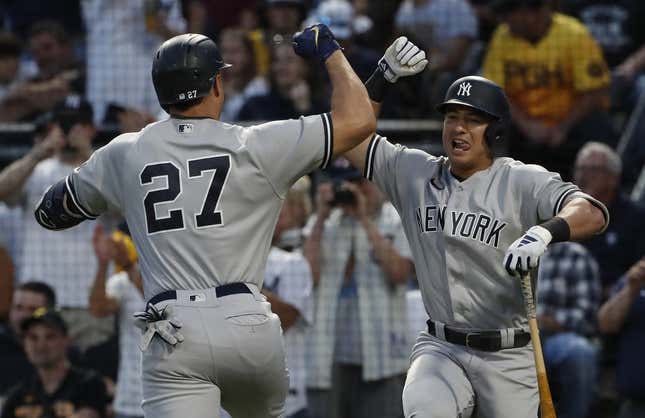 Sep 16, 2023; Pittsburgh, Pennsylvania, USA; New York Yankees shortstop Anthony Volpe (right) congratulates designated hitter Giancarlo Stanton (27) on his solo home run against the Pittsburgh Pirates during the third inning at PNC Park.