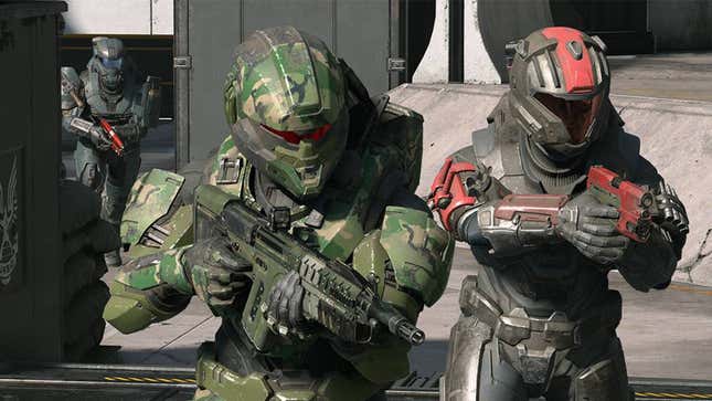 Two spartans with pistols and one with a commando walk down a platform in Halo Infinite.