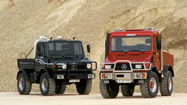 Two Unimog trucks parked in a quarry 