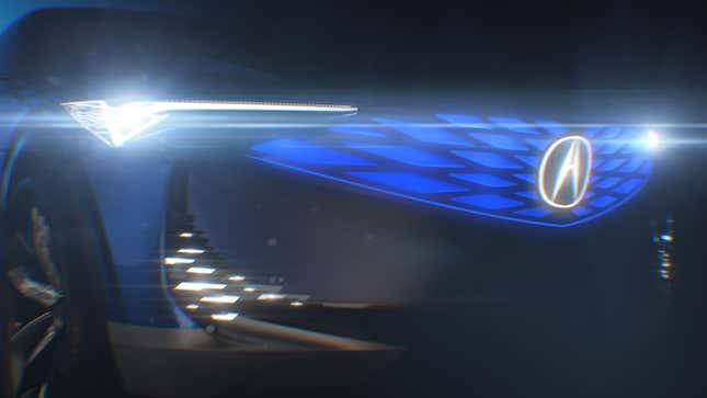 Teaser image of an electric Acura concept with blue light-up grille and badge.