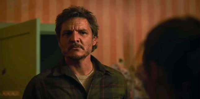 Pedro Pascal is seen as Joel in The Last of Us looking sternly and fatherly at Bella Ramsey as Ellie.