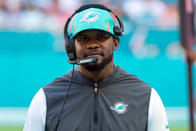 Miami Dolphins head coach Brian Flores smiles on the sidelines during an NFL football game against the Carolina Panthers, on Nov. 28, 2021, in Miami Gardens, Fla. The Pittsburgh Steelers hired the former Miami Dolphins coach on Saturday, Feb. 19, 2022, to serve as a senior defensive assistant. The hiring comes less than three weeks after Flores sued the NFL and three teams over alleged racist hiring practices following his dismissal by Miami in January.