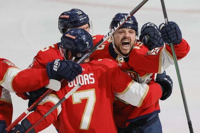 May 7, 2023; Sunrise, Florida, USA; Florida Panthers center Sam Reinhart (13) celebrates with defenseman Radko Gudas (7) and center Anton Lundell (15) after scoring the game-winning goal against the Toronto Maple Leafs during overtime in game three of the second round of the 2023 Stanley Cup Playoffs at FLA Live Arena.