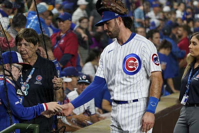 Jul 1, 2023; Chicago, Illinois, USA; Chicago Cubs shortstop Dansby Swanson (7) signs an autograph before the game between the Chicago Cubs and the Cleveland Guardians at Wrigley Field.