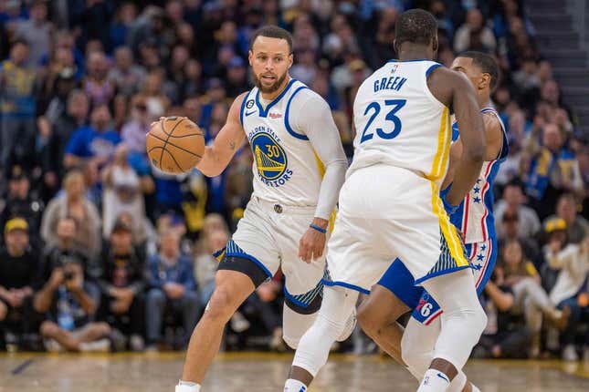 Mar 24, 2023; San Francisco, California, USA;  Golden State Warriors guard Stephen Curry (30) dribbles the basketball against the Philadelphia 76ers in the fourth quarter at Chase Center.