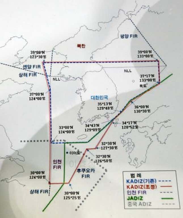 A map of South Korea and its region shows the Air Defense Identification Zone (ADIZ) set up by three east Asian nations at Defense Ministry in Seoul, South Korea, Sunday, Dec. 8, 2013. South Korea on Sunday announced expansion of its air defense zone following China's move to establish a similar zone that has been criticized by Beijing's neighbors. Green line signifies ADIZ set up by Japan as blue dotted line is ADIZ set up by South Korea before they unveiled on Sunday an expanded new ADIZ which is shown in red line. Gray dotted line in the bottom is ADIZ set up by China. Photo: Lee Jin-man, AP