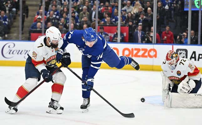 Jan 17, 2023; Toronto, Ontario, CAN; Toronto Maple Leafs forward Bobby McMann (74) deflects the puck between Florida Panthers defenseman Radko Gudas (7) and goalie Sergei Bobrovsky (72) in the first period at Scotiabank Arena.