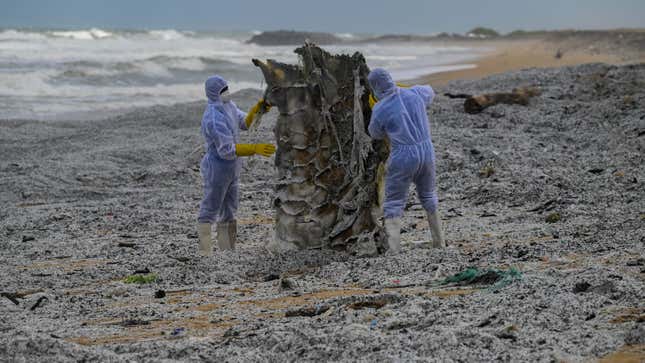 Sri Lankan Navy soldiers work among a sea of plastic to remove debris washed ashore from the MV X-Press Pearl on May 28.