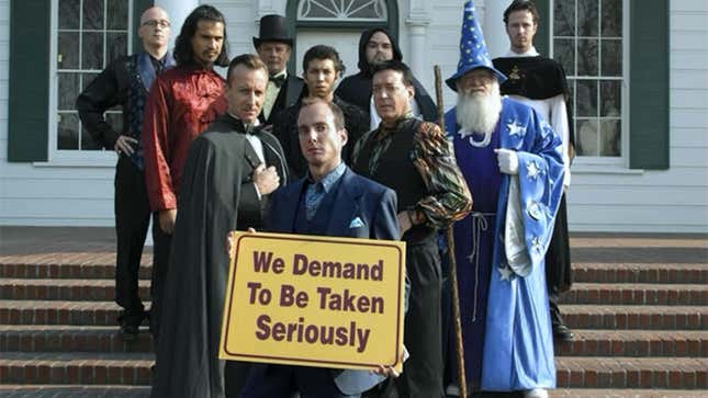 A screenshot from Arrested Development, showing a group of magicians demanding to be taken seriously.