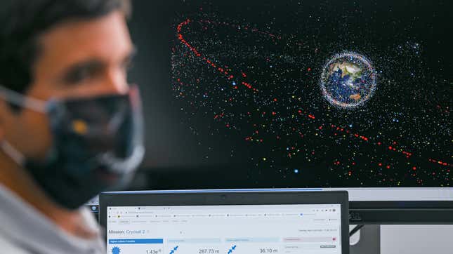 An engineer sits in front of a monitor showing an animation of space debris at the European Space Agency's (ESA) new Space Safety Center, located at the European Satellite Operations Center (ESOC) in Darmstadt, Germany.