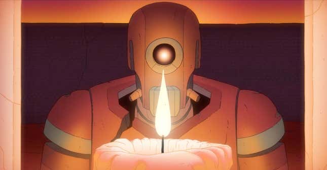 A robot stares over a candle flame in a frame from animated film The Desert.