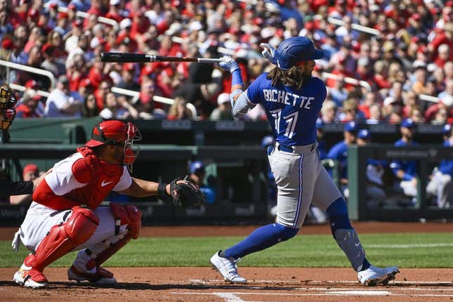 Mar 30, 2023; St. Louis, Missouri, USA;  Toronto Blue Jays shortstop Bo Bichette (11) hits a single against the St. Louis Cardinals during the first inning at Busch Stadium.