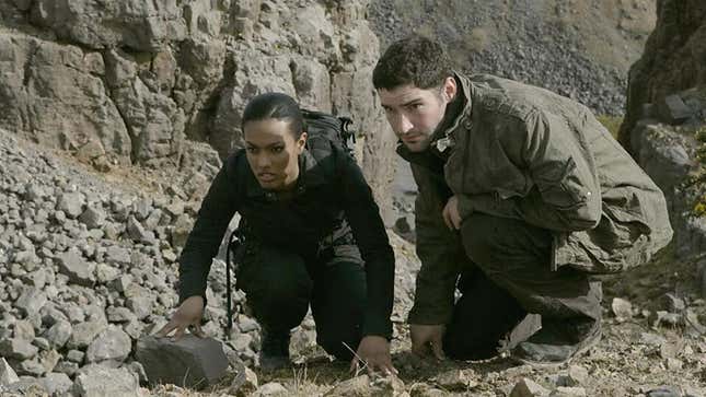 Freema Agyeman and Tom Ellis as Martha Jones and Thomas Milligan, overlooking a rocky outlook, in "The Last of the Time Lords"