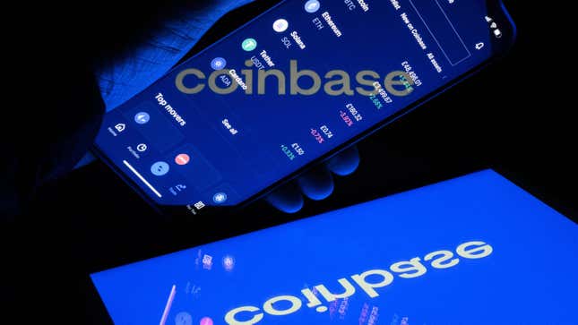A phone screen reading coinbase hovering over another screen with the word reflected backward.