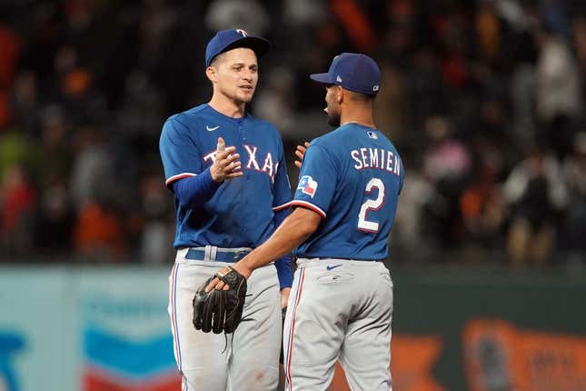 Aug 12, 2023; San Francisco, California, USA; Texas Rangers shortstop Corey Seager (left) celebrates with second baseman Marcus Semien (2) after defeating the San Francisco Giants at Oracle Park.