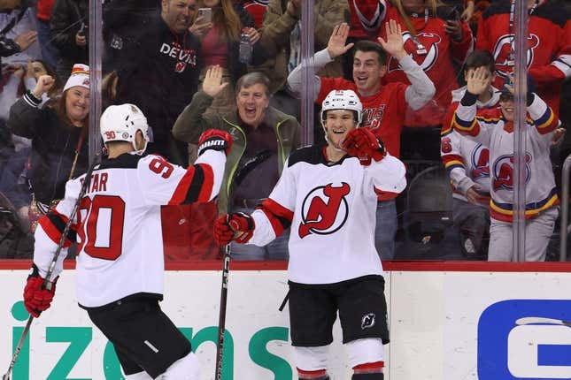Feb 25, 2023; Newark, New Jersey, USA; New Jersey Devils center Dawson Mercer (91) celebrates his goal against the Philadelphia Flyers during the second period at Prudential Center.