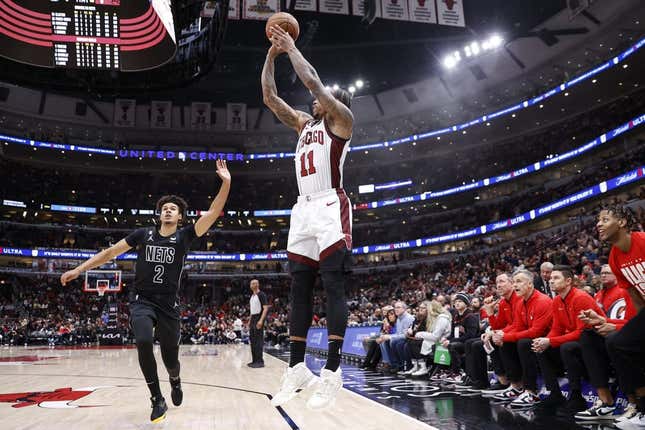 Feb 24, 2023; Chicago, Illinois, USA; Chicago Bulls forward DeMar DeRozan (11) shoots against the Brooklyn Nets during the first half at United Center.