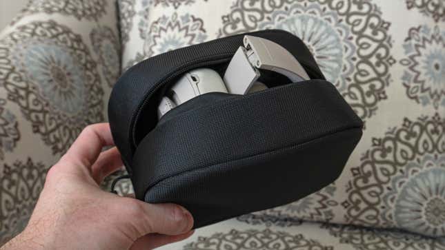 The Beats Studio Pro wireless headphones folded and inside their included carrying case with the zipper left open.