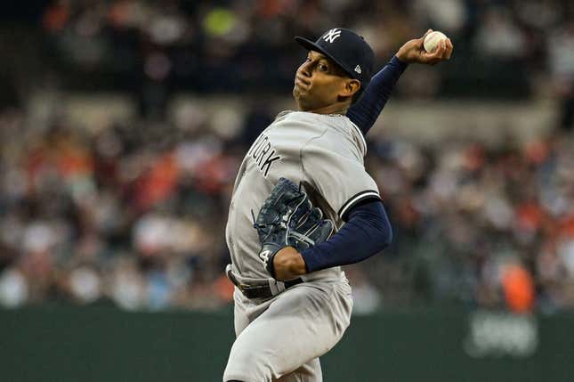 Apr 8, 2023; Baltimore, Maryland, USA;  New York Yankees starting pitcher Jhony Brito (76)  throws a first inning pitch against the Baltimore Orioles at Oriole Park at Camden Yards.