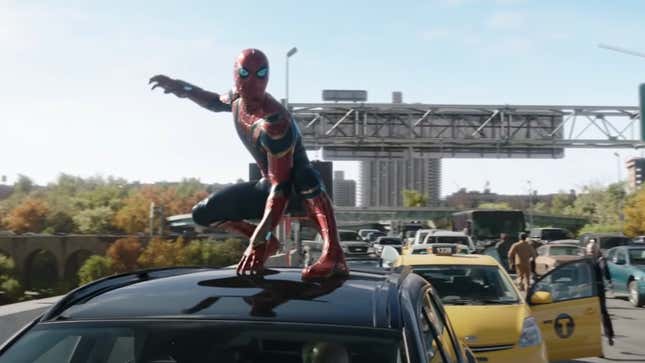 Tom Holland's Peter Parker crouches atop a car in traffic in his Iron Spider armor, ready for battle in Spider-Man: No Way Home.