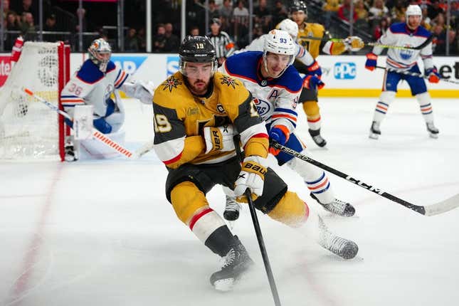 May 12, 2023; Las Vegas, Nevada, USA; Vegas Golden Knights right wing Reilly Smith (19) skates ahead of Edmonton Oilers center Ryan Nugent-Hopkins (93) during the third period of game five of the second round of the 2023 Stanley Cup Playoffs at T-Mobile Arena.