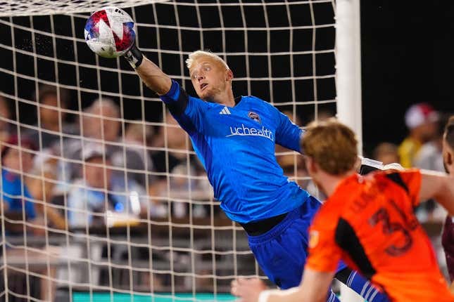 Jul 15, 2023; Commerce City, Colorado, USA; Colorado Rapids goalkeeper William Yarbrough (22) makes an incredible save against the Houston Dynamo FC during the second half at Dick's Sporting Goods Park.
