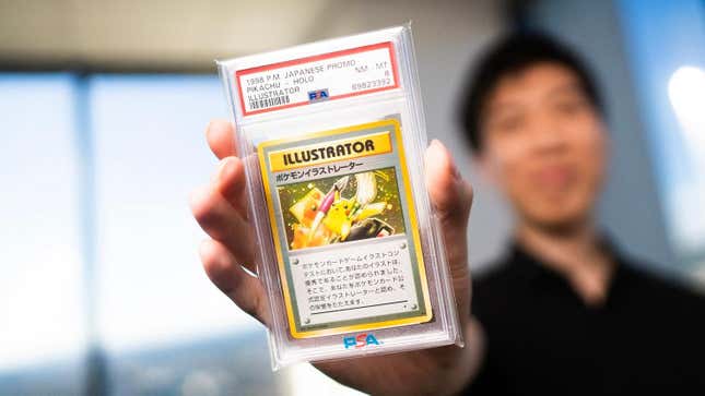 An Illustrator Pikachu card to be auctioned on eBay is held up.