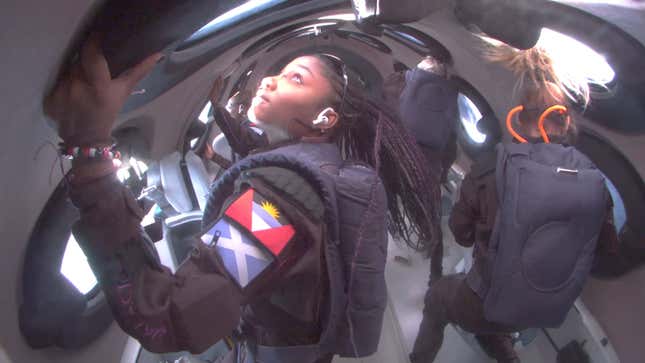 Anastatia Mayers pictured looking out the window of the spaceplane during the flight.