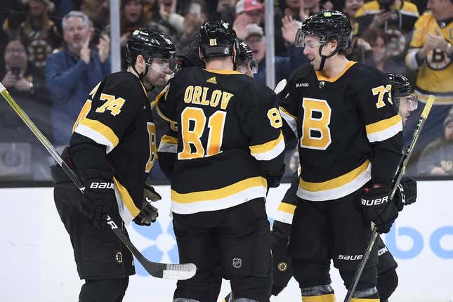 Mar 4, 2023; Boston, Massachusetts, USA; Boston Bruins left wing Jake DeBrusk (74) defenseman Dmitry Orlov (81) left wing Brad Marchand (63) and defenseman Charlie McAvoy (73) celebrate a goal by center Patrice Bergeron (37) during the third period against the New York Rangers at TD Garden.
