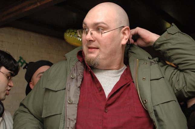 Mike Fahey of Kotaku looks to the left while wearing glasses.