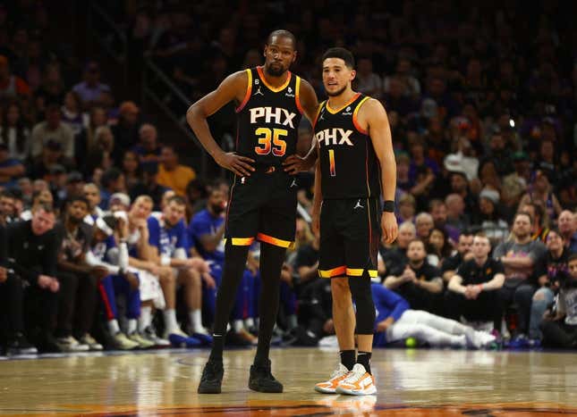 Apr 18, 2023; Phoenix, Arizona, USA; Phoenix Suns guard Devin Booker (1) with forward Kevin Durant (35) against the Los Angeles Clippers in the second half during game two of the 2023 NBA playoffs at Footprint Center.
