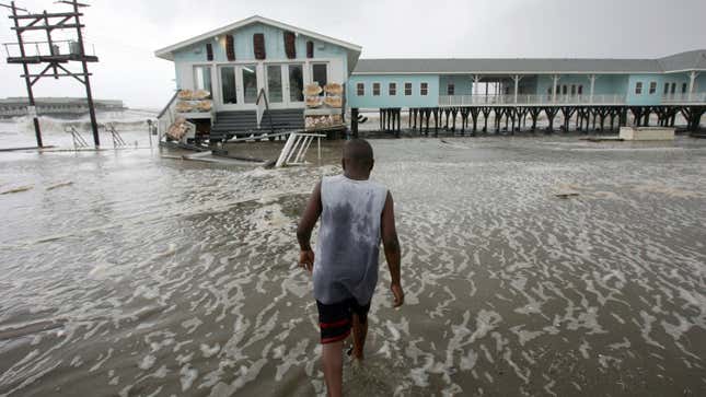 Frederick York, 10, of Galveston wades in the flooded street after swells caused by Hurricane Ike forming in the Gulf of Mexico broke over the sea wall in Galveston, Texas September 12, 2008.