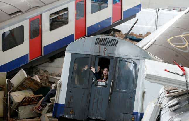 Simulated casualties look out from a Tube train carriage.