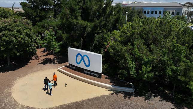  In an aerial view, people gather in front of a sign posted at Meta headquarters on July 07, 2023 in Menlo Park, California.