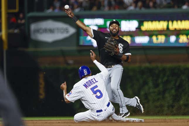 Aug 16, 2023; Chicago, Illinois, USA; Chicago White Sox shortstop Elvis Andrus (1) throws out Chicago Cubs second baseman Christopher Morel (5) at second base during the seventh inning at Wrigley Field.