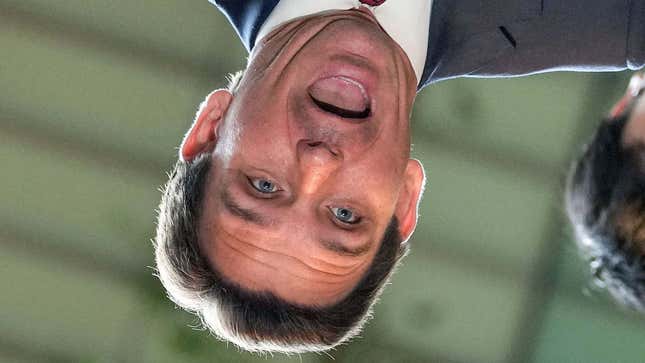 A photograph shows Ron DeSantis upside down and screaming. 
