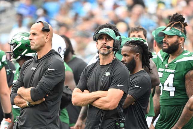 Aug 12, 2023; Charlotte, North Carolina, USA; New York Jets quarterback Aaron Rodgers (8) behind Robert Saleh on the sidelines in the third quarter at Bank of America Stadium.