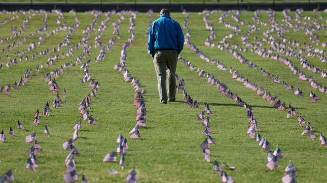 A man walking through a memorial at the National Mall in Washington, DC, created this September to commemorate the 200,000 American lives lost to the pandemic at the time. As many as 500,000 Americans may die before the pandemic ends, some experts have estimated. 