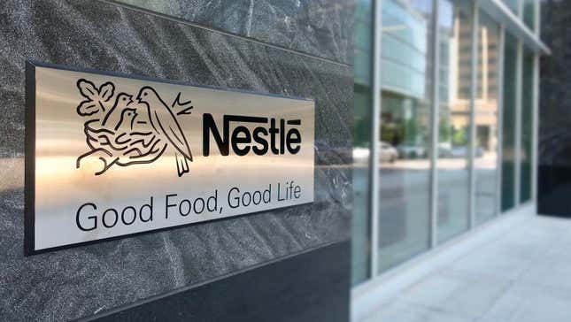 The Nestle logo on the side of a building. 