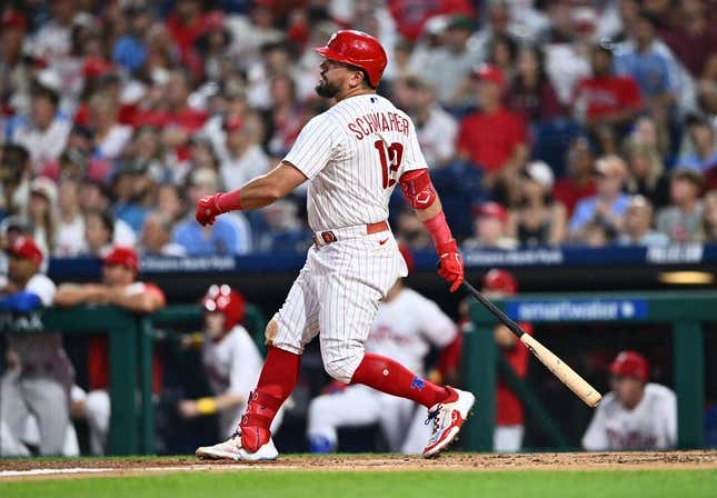 Sep 9, 2023; Philadelphia, Pennsylvania, USA; Philadelphia Phillies outfielder Kyle Schwarber (12) hits a three-run home run against the Miami Marlins in the second inning at Citizens Bank Park.