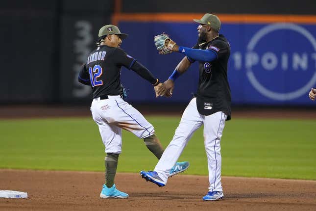 May 21, 2023; New York City, New York, USA; New York Mets shortstop Francisco Lindor (12) and right fielder Starling Marte (6) low five to celebrate the victory after the game against the Cleveland Guardians at Citi Field.