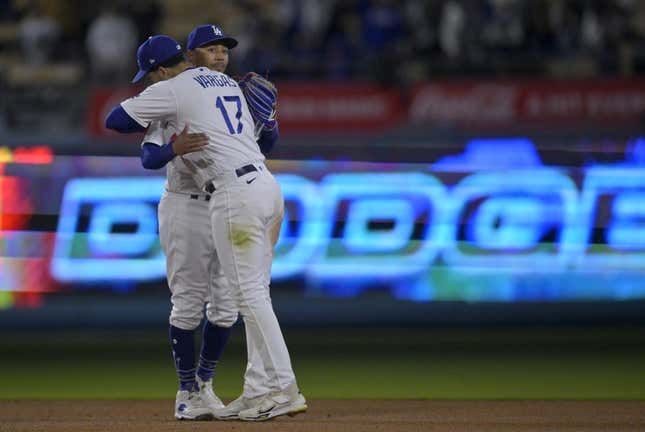 May 29, 2023; Los Angeles, California, USA;  Los Angeles Dodgers right fielder Mookie Betts (50) and second baseman Miguel Vargas (17) embrace after the final out of the ninth inning defeating the Washington Nationals at Dodger Stadium.